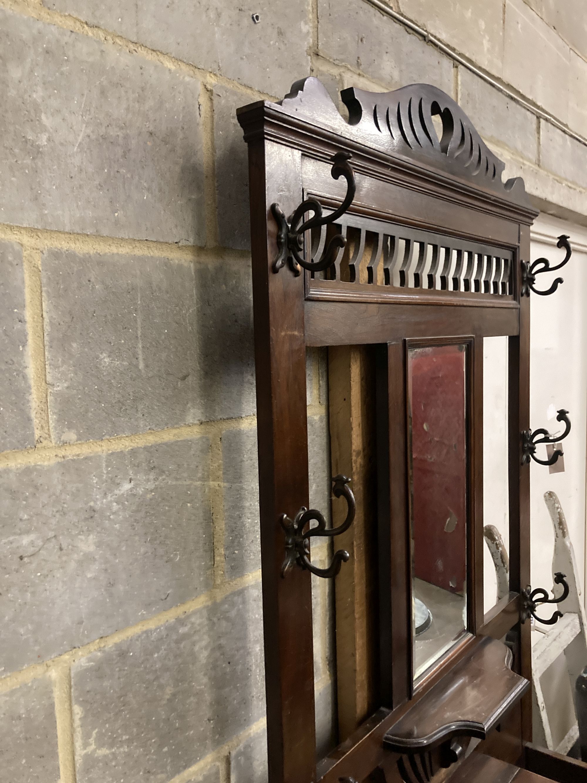 A late Victorian mahogany hallstand, width 93cm, depth 29cm, height 210cm